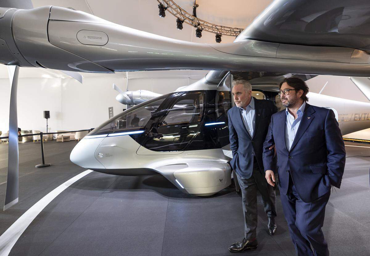 Stuart Simpson, right, chief executive officer of Vertical Aerospace, and Dómhnal Slattery, chairman of the board of Vertical Aerospace, give a tour of the company's Valo, a next-generation electric aircraft, during a public display event at Collins Park on Tuesday, Feb. 24, 2026, in Miami Beach, Fla. 