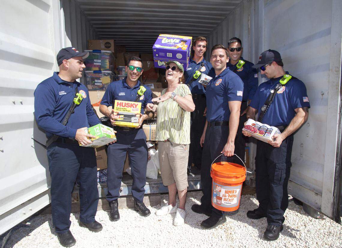 Amy Culver, center, is pictured in September of 2019 with Monroe County Fire Rescue team members from Station 8 on Stock Island with a container load of supplies collected for Bahamas hurricane relief.