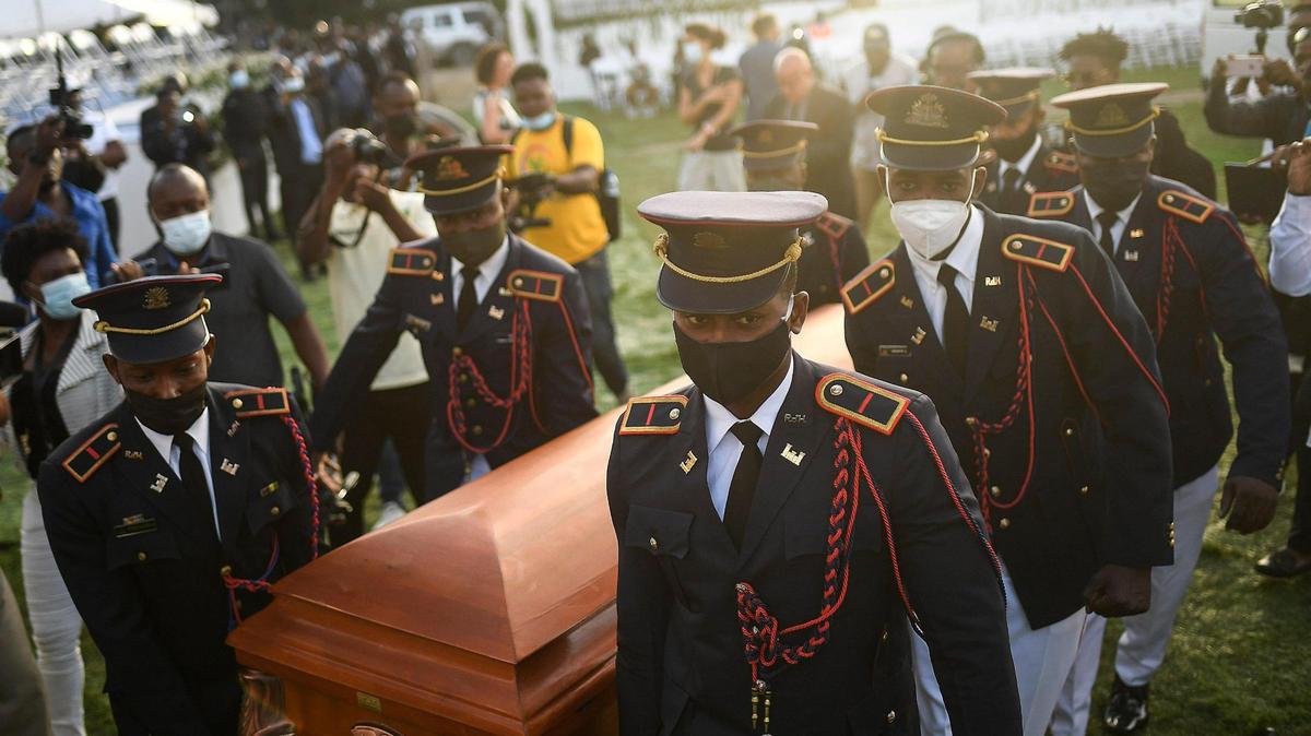 Police carry the coffin of slain Haitian President Jovenel Moïse during his funeral at his family home in Cap-Haitien, Haiti, early Friday, July 23, 2021. Moïse was assassinated at his home in Port-au-Prince on July 7.