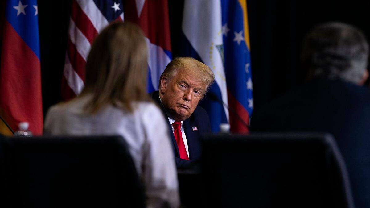 President Donald J. Trump listens as a group of members from the Venezuelan and the Cuban exile communities talk about the situation in their countries under socialist regimes during a meeting at Iglesia Doral Worship center Church in Doral after he visited the U.S. Southern Command, on Friday, July 10, 2020.