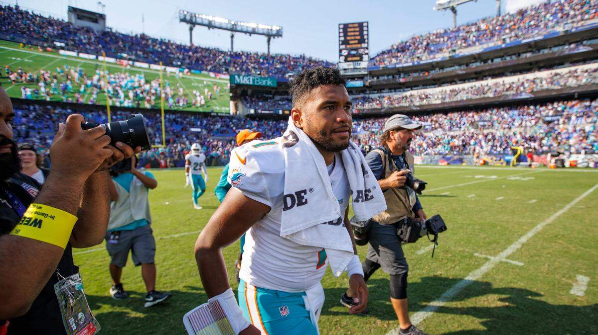 Miami Dolphins quarterback Tua Tagovailoa (1) runs out the field after their 42-38 win over the Baltimore Ravens during an NFL football game at M&T Bank Stadium on Sunday, September 18, 2022 in Baltimore, MD.