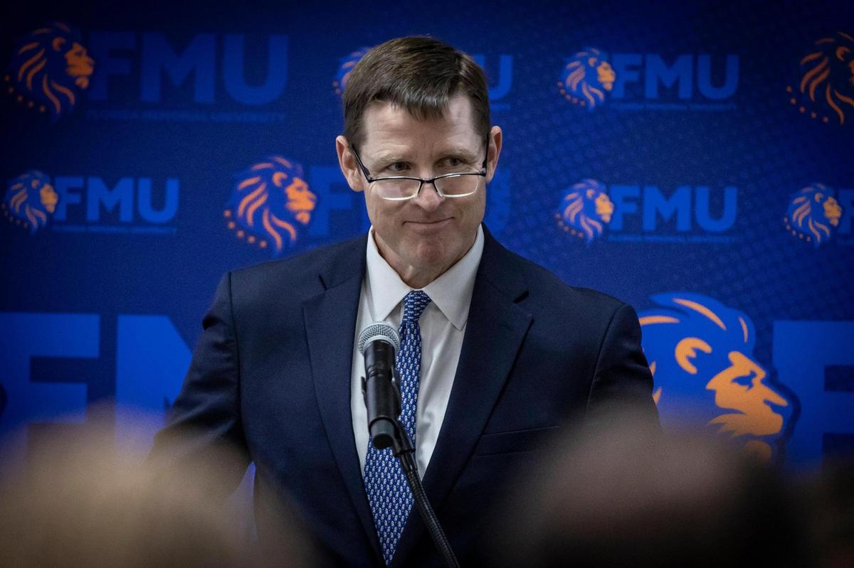 Tim Berry of JPMorgan Chase takes in the applause from guests after announcing a $1 million donation to FMU.