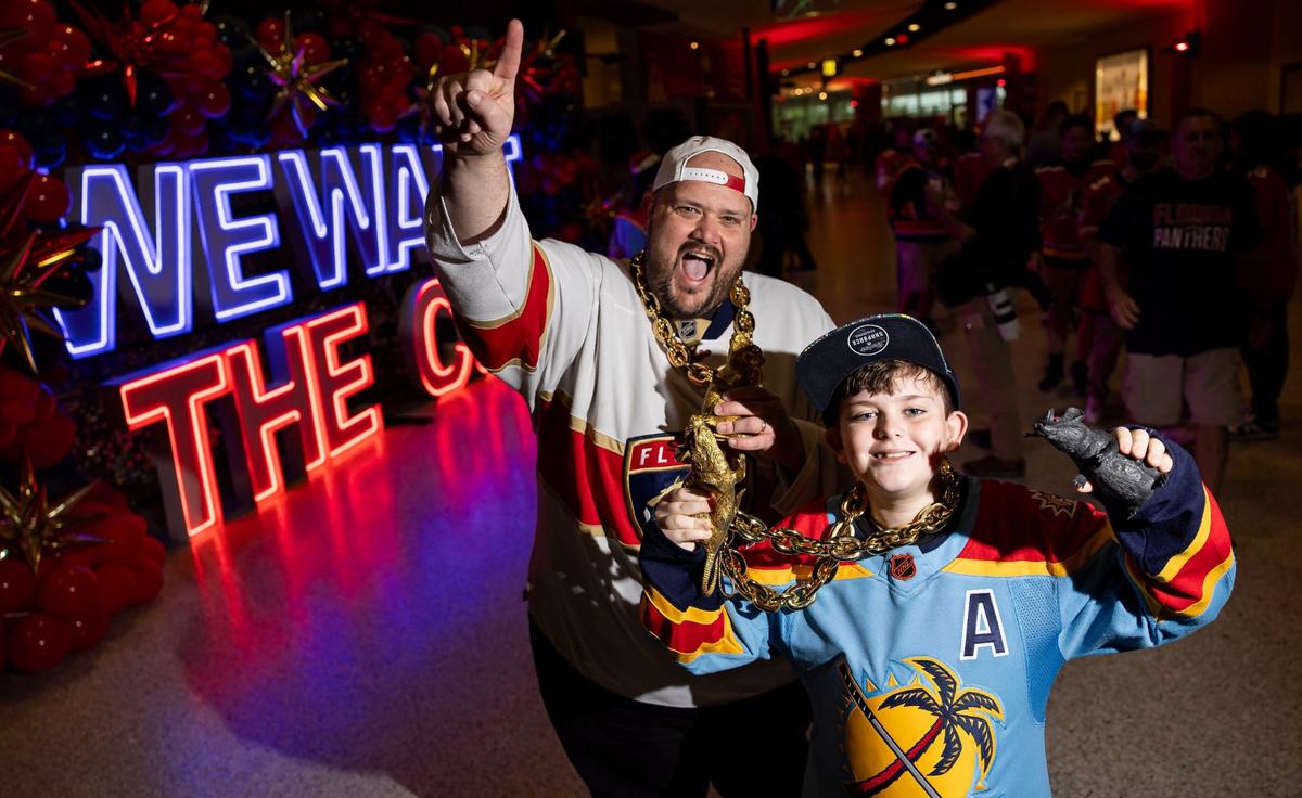 Fred Ferrara, 42, and his son, Fred, 11, arrive to a watch party at the Amerant Bank Arena to see their team play against the Edmonton Oilers in Game 4 of the NHL Stanley Cup Final