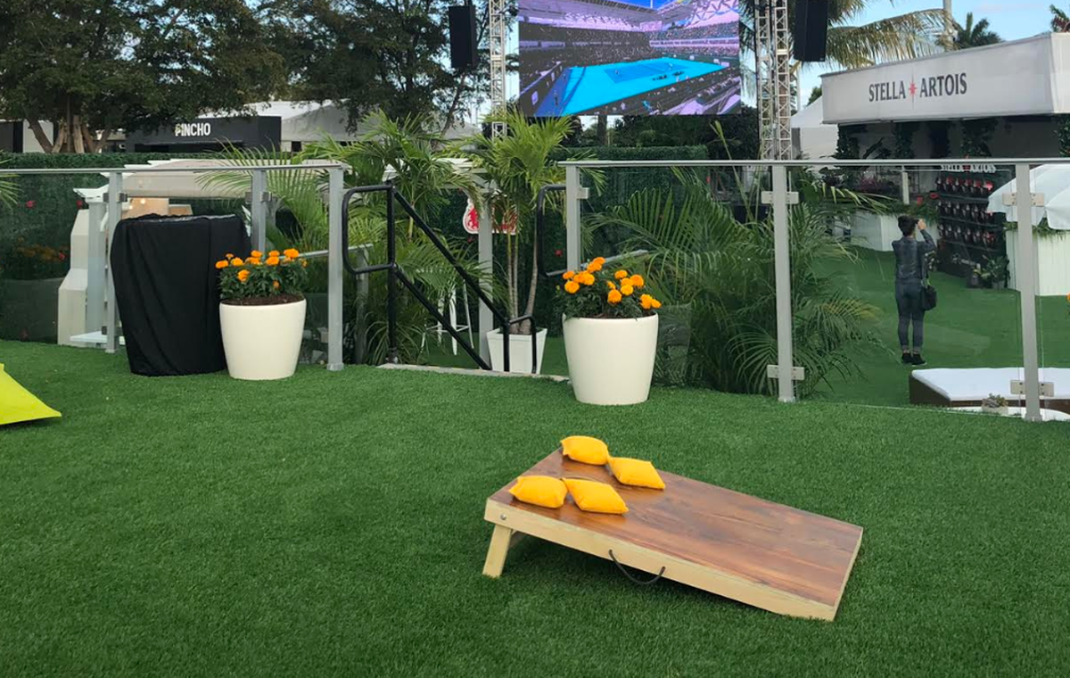 A game of cornhole at Hard Rock Stadium