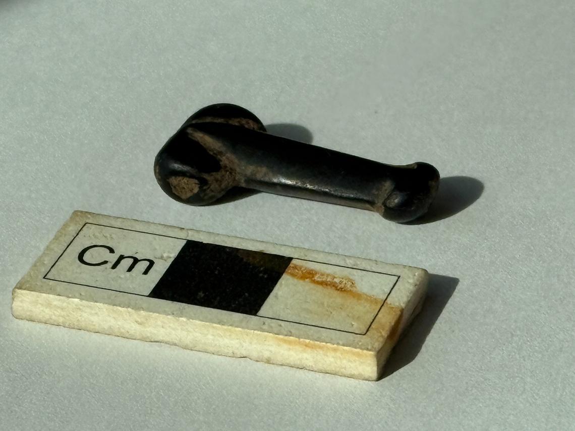 The pendant was likely warn around the neck to keep the stone close to the body, archaeologists said.