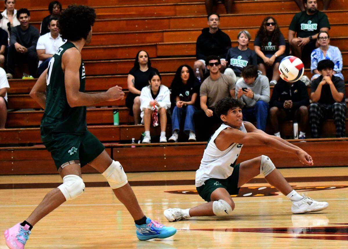 Reagan junior libero Santiago Mejia hits the hardwoods to set up a shot against Lake Howell during the FHSAA Class 2A boys volleyball state championship match on Saturday at Polk State College in Winter Haven.