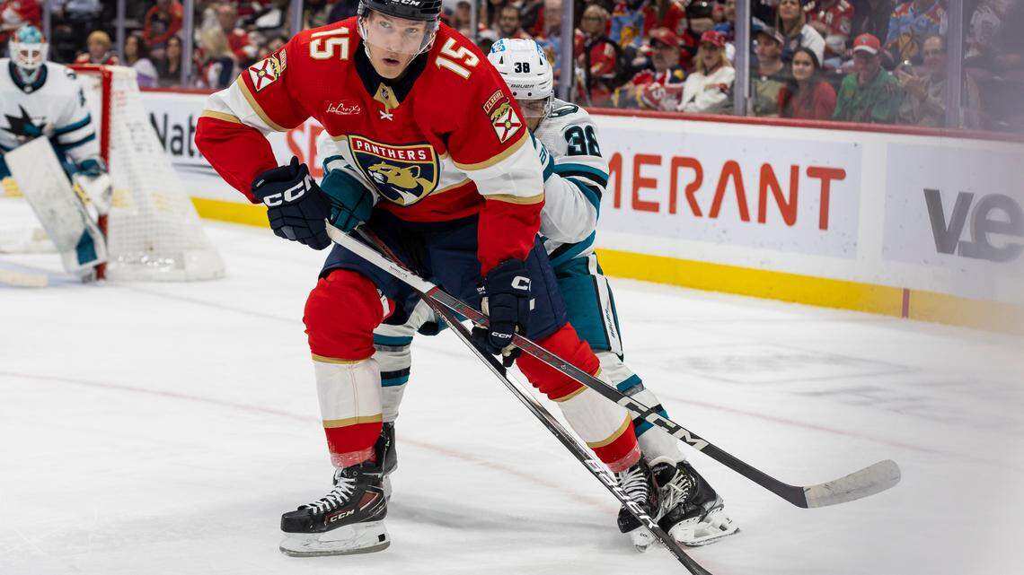 Florida Panthers center Anton Lundell (15) and San Jose Sharks defenseman Mario Ferraro (38) compete for the puck in the first period of their NHL game at the Amerant Bank Arena on Tuesday, Oct. 24, 2023, in Sunrise, Fla.