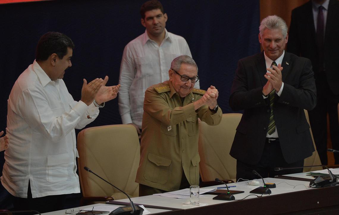 The First Secretary of the Cuban Communist Party, former President Raúl Castro, gestures during the commemoration of the 14th anniversary of Bolivarian Alliance for the Peoples of Our America Peoples’ Trade Treaty (ALBA-TCP) as Venezuelan President Nicolás Maduro, left, and Cuban President Miguel Díaz-Canel applaud at the Convention Palace in Havana on Dec. 14, 2018.