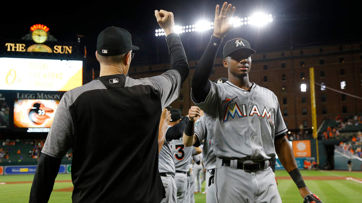 Miami Marlins center fielder Lewis Brinson, right, celebrates after a baseball game against the Baltimore Orioles, Friday, June 15, 2018, in Baltimore. (AP Photo/Patrick Semansky)