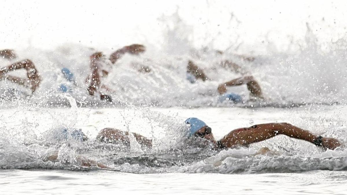 Participants compete in the swimming course of the Ironman in Miami in 2014.