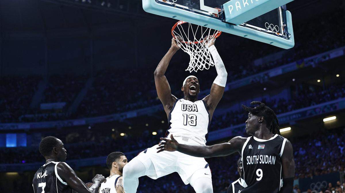 USA’s Bam Adebayo (13) reacts after a dunk in the men’s preliminary round group C basketball match against South Sudan during the Paris 2024 Olympic Games at the Pierre-Mauroy stadium in Villeneuve-d’Ascq, northern France, on Wednesday, July 31, 2024. (Sameer Al-Doumy/AFP/Getty Images/TNS)