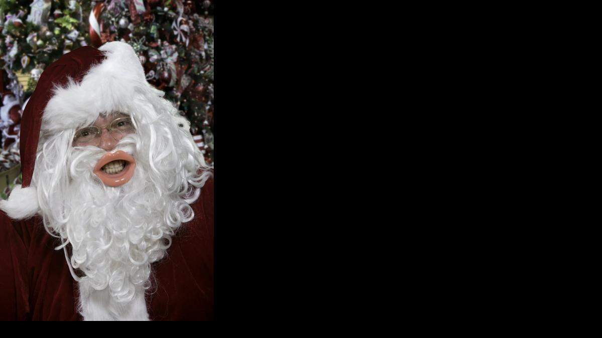 Ho ho ho: Santa models the Face Slimmer Exercise Mouthpiece.

