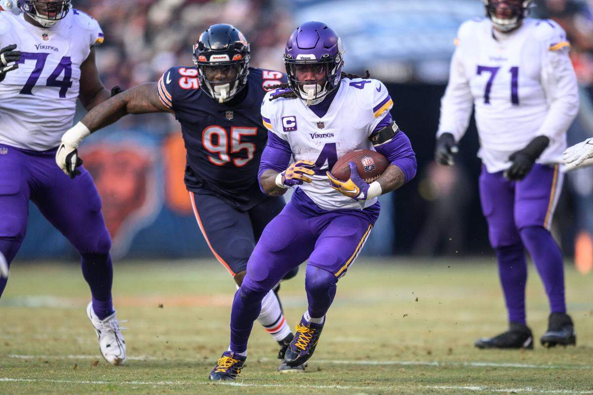 Jan 8, 2023; Chicago, Illinois, USA; Minnesota Vikings running back Dalvin Cook (4) runs the ball during the second quarter against the Chicago Bears at Soldier Field. Mandatory Credit: Daniel Bartel-USA TODAY Sports