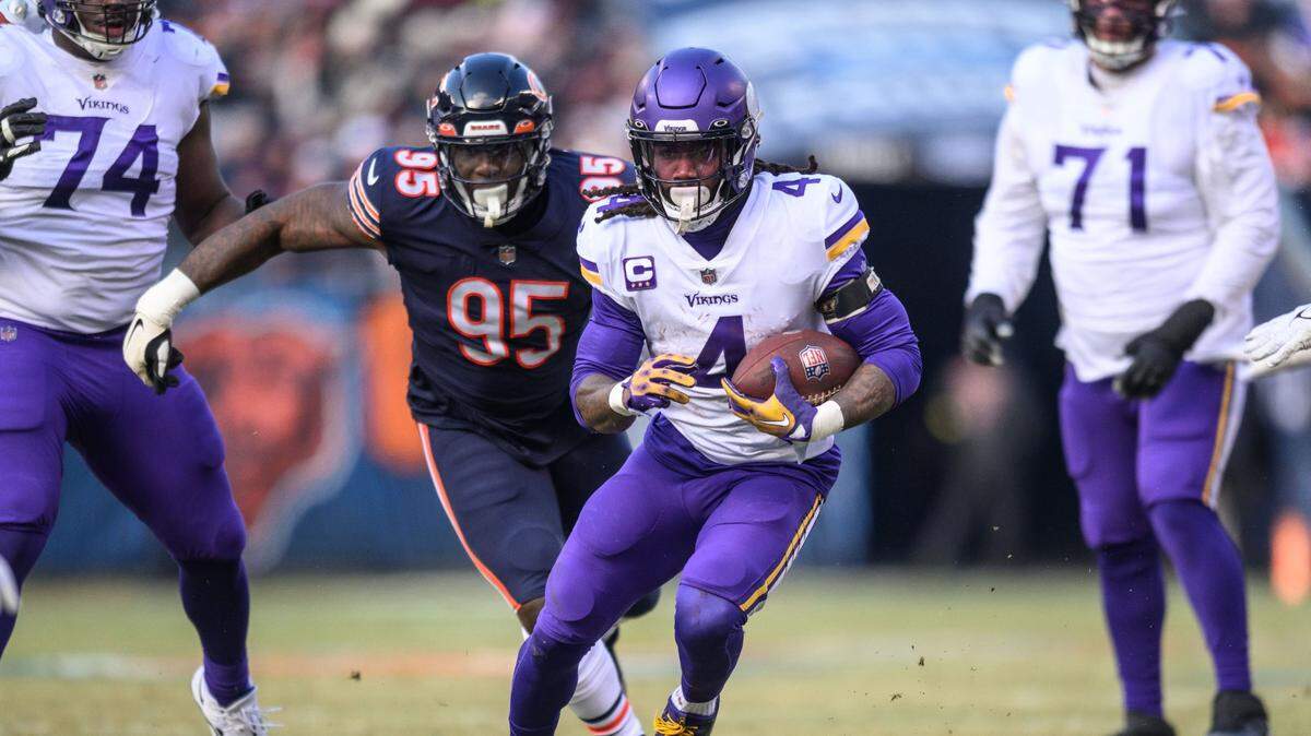 Jan 8, 2023; Chicago, Illinois, USA; Minnesota Vikings running back Dalvin Cook (4) runs the ball during the second quarter against the Chicago Bears at Soldier Field. Mandatory Credit: Daniel Bartel-USA TODAY Sports