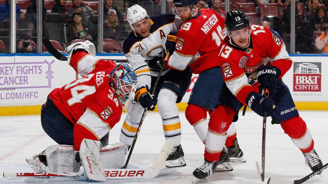 The Florida Panthers’ Mark Pysyk (13) defends against Buffalo Sabres’ Kyle Okposo (21) during the Panthers 3-2 overtime victory Friday night.