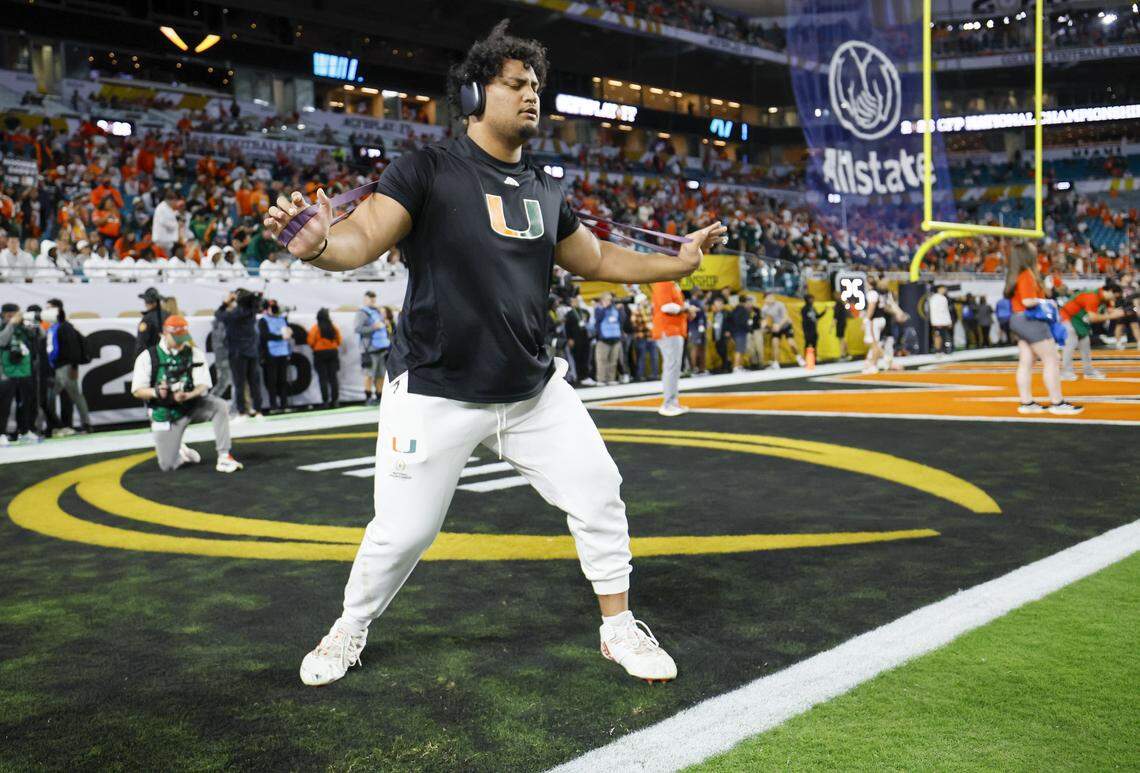 Miami Hurricanes offensive lineman Francis Mauigoa (61) warms up before the game between the Miami Hurricanes and the Indiana Hoosiers in the College Football Playoff National Championship Game at Hard Rock Stadium in Miami Gardens, Florida, on Monday, January 19, 2026.