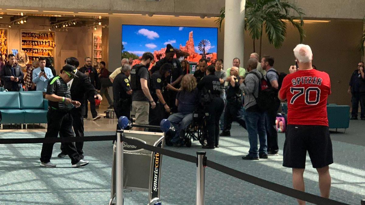 Man detained at Orlando Airport. Photo by Zachary Jaydon / Twitter