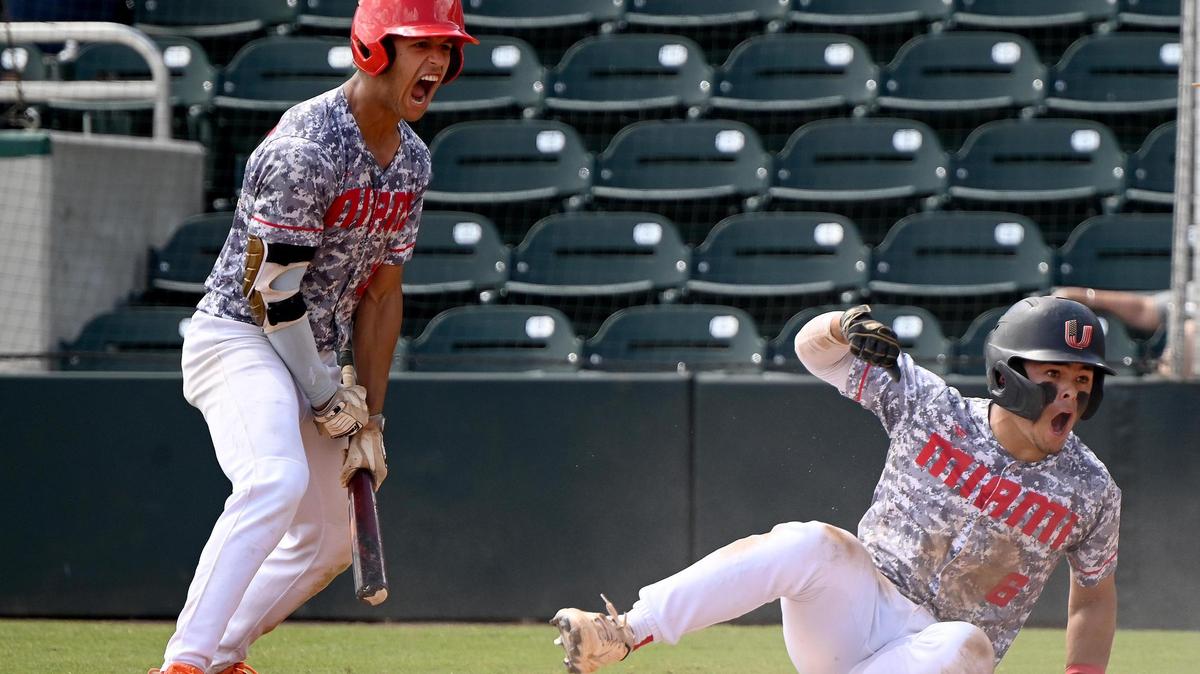 Miami Christian High School Roy Quevedo (6) steals home base while Chris Diaz (26) celebrating the run during their state semifinal game with Foundation Academy in Class 2A game Fort Myers, Monday, May 23, 2022.(Photo/Chris Tilley)