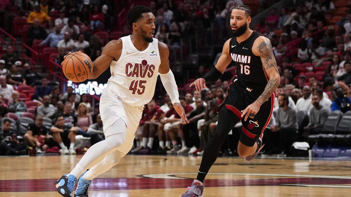 Cleveland Cavaliers guard Donovan Mitchell (45) drives the ball around Miami Heat forward Caleb Martin (16) during a basketball game at Kaseya Center in Miami. Bradenton’s IMG Academy will host the Cavs’ preseason training camp in October.