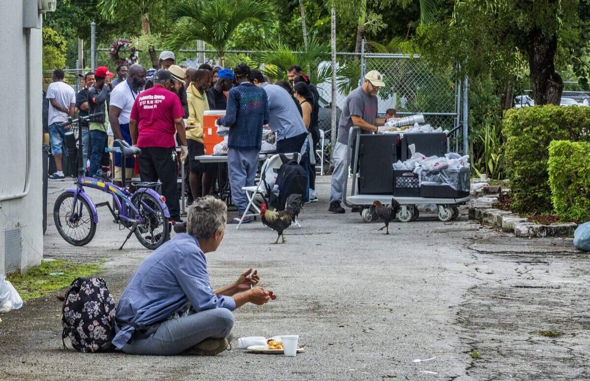 A man eats a plate of breakfast from Nourish Miami’s morning food service at the Greater Bethel African Methodist Episcopal Church in Overtown, Miami, on Friday, June 5, 2026.