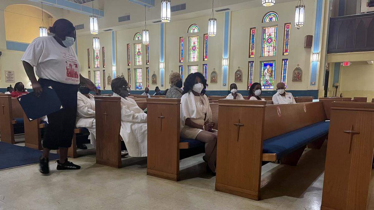 Members of the St. Theresa Chapter of the Episcopal Churchwomen sit in the pews of the Historic Saint Agnes Episcopal Church in the Overtown neighborhood of Miami, Florida, on Sunday, Sept. 25, 2022. Comprised of Black women with the goal of bettering their community, the group celebrated 50 years of service on Sunday.