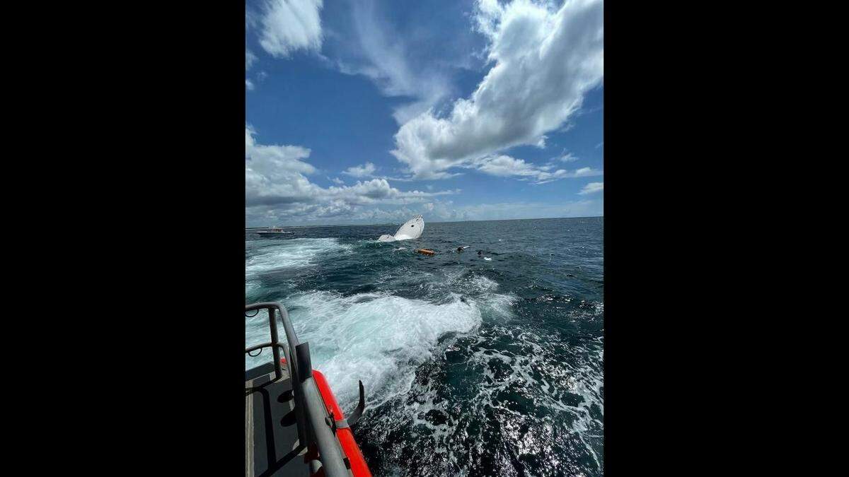 The boat started taking on water after running aground, according to the Coast Guard.