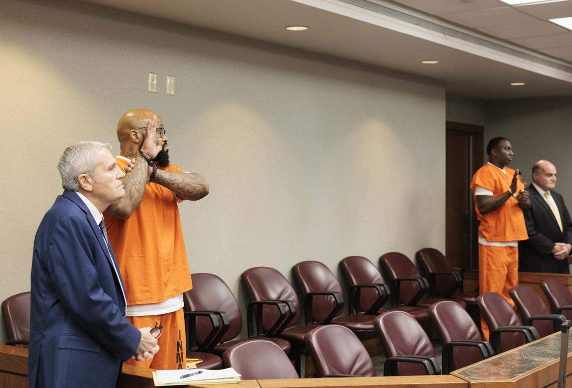 Reginald Louis Jackson, left, and Roderick Martin, both accused of 2013 double murder of a church minister and her grandson in her Miami Gardens home, plead guilty and then receive sentencing on Wednesday, April 29, 2026, inside the Richard E. Gerstein Justice Building in downtown Miami, Fla.
