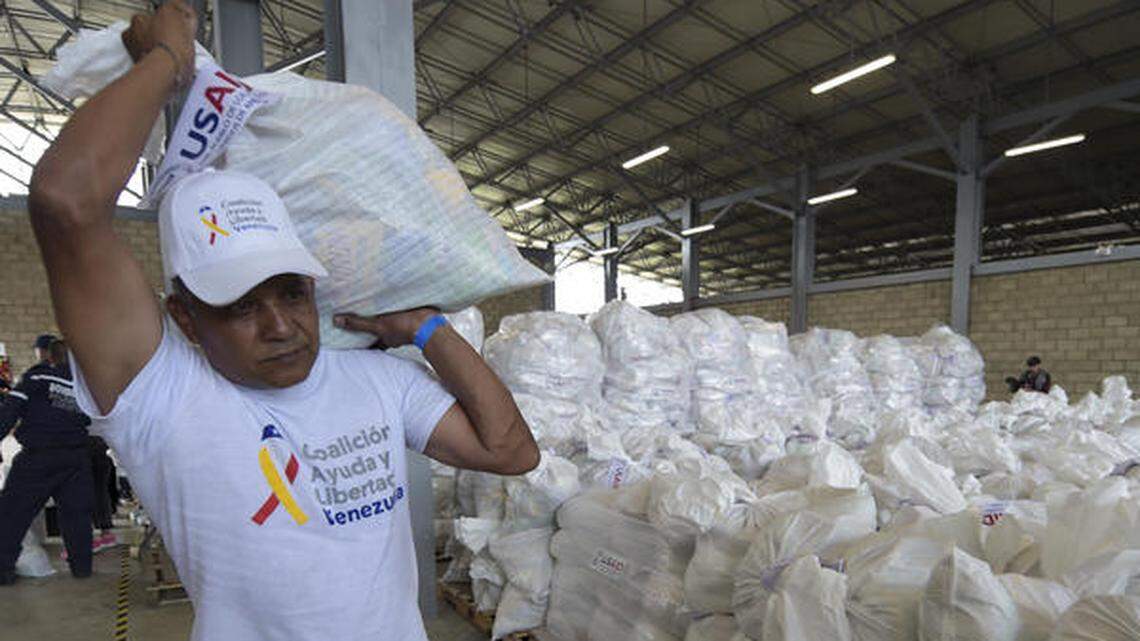 A volunteer carries a bag with U.S. humanitarian aid in Cúcuta, Colombia, along the Venezuelan border.
