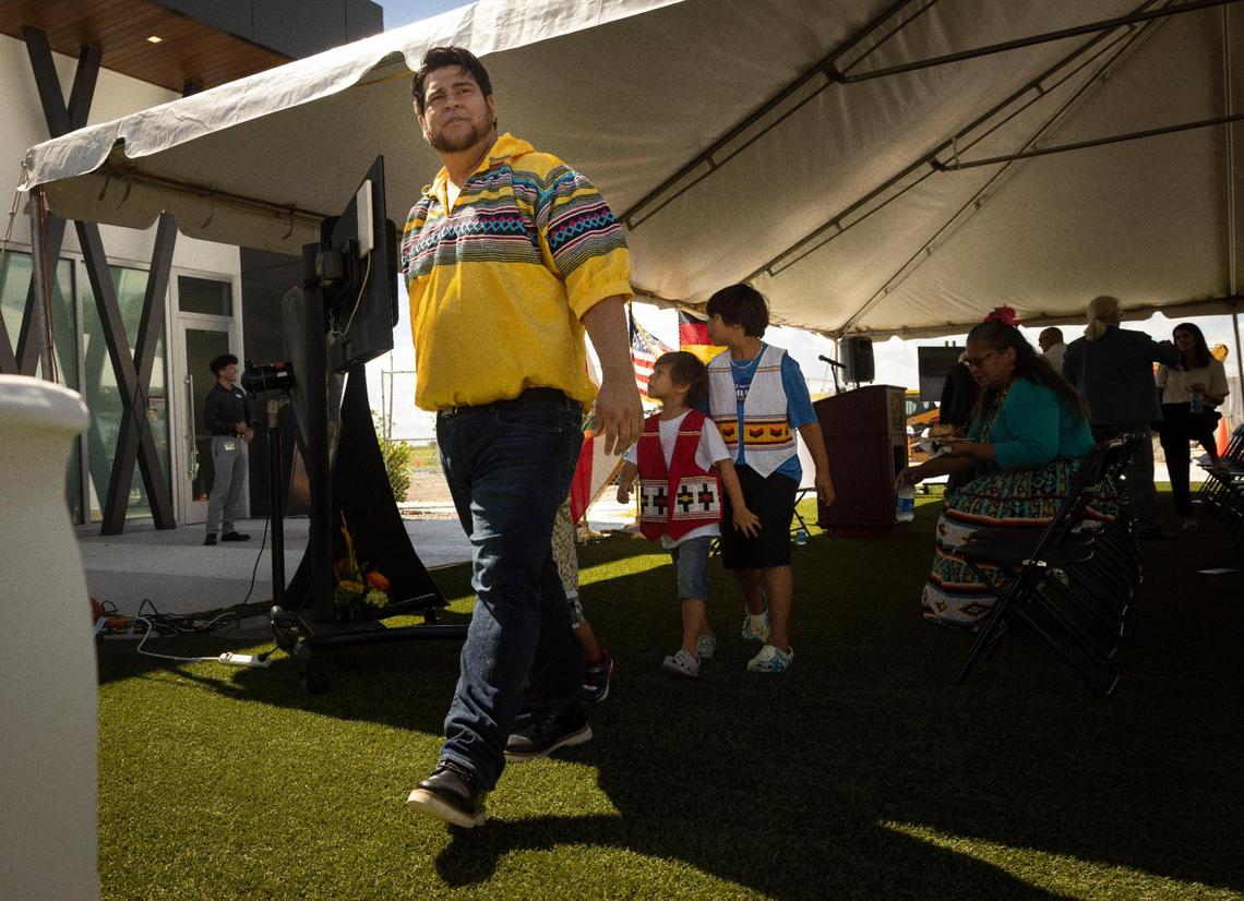 Lucas Osceola,35, assistant chairman of the business council, leads children from the tribe around the space after a press conference announcing a new casino being built by the Miccosukee tribe on Wednesday, Aug. 16, 2023, at the Miccosukee Service Plaza in Ochopee, Fla.