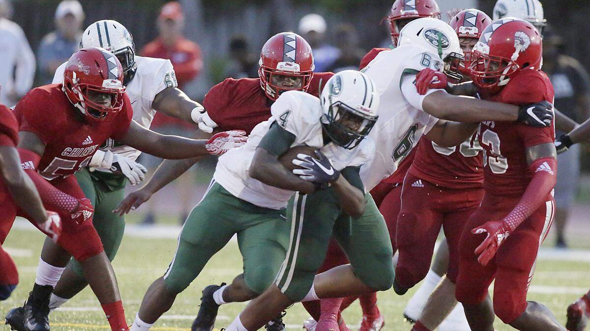 Miami Central Rockets’ running back Lexington Joseph (4) carries the ball against Cardinal Gibbons Chiefs during the football game Saturday, August 25, 2018 at Cardinal Gibbons High in Fort Lauderdale