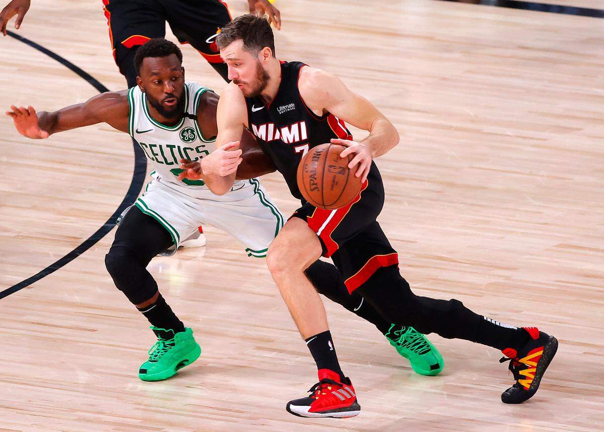 LAKE BUENA VISTA, FLORIDA - SEPTEMBER 27: Goran Dragic #7 of the Miami Heat drives against Kemba Walker #8 of the Boston Celtics during the third quarter in Game Six of the Eastern Conference Finals during the 2020 NBA Playoffs at AdventHealth Arena at the ESPN Wide World Of Sports Complex on September 27, 2020 in Lake Buena Vista, Florida. NOTE TO USER: User expressly acknowledges and agrees that, by downloading and or using this photograph, User is consenting to the terms and conditions of the Getty Images License Agreement. (Photo by Kevin C. Cox/Getty Images)
