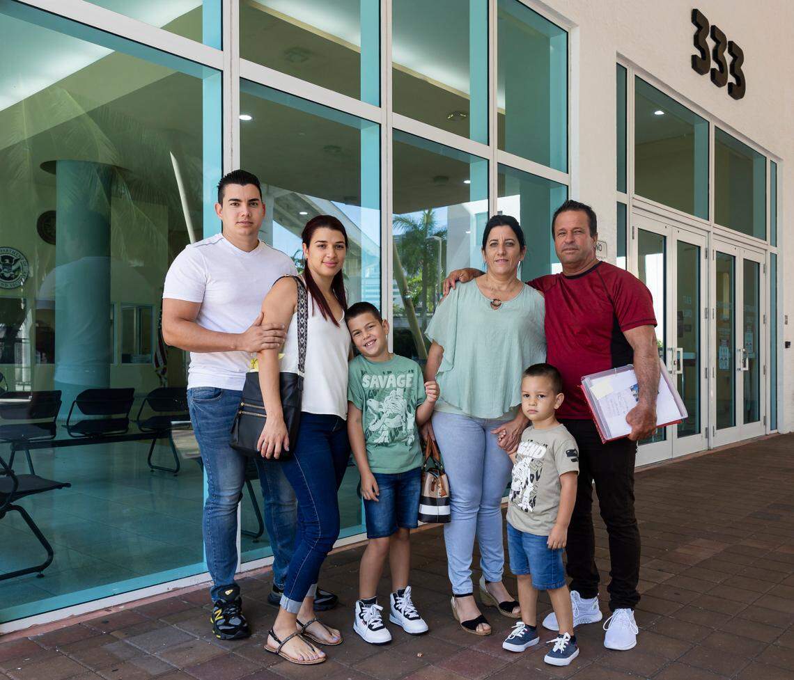 From left to right: Brayan Soto, 26, Karen Camejo, 26, Michele Soto, 7, Lisett Ania Suarez, 49, Jeison Soto, 3, and Juan Carlos Otaño, 58, stand outside Miami’s immigration court on May 31, 2024. It was the family’s first hearing with an immigration judge after they entered the United States in March, where they were given parole at the border.