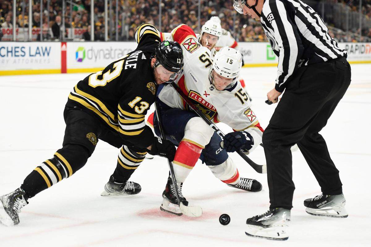 May 17, 2024; Boston, Massachusetts, USA; Boston Bruins center Charlie Coyle (13) and Florida Panthers center Anton Lundell (15) battle for the puck during the second period in game six of the second round of the 2024 Stanley Cup Playoffs at TD Garden.