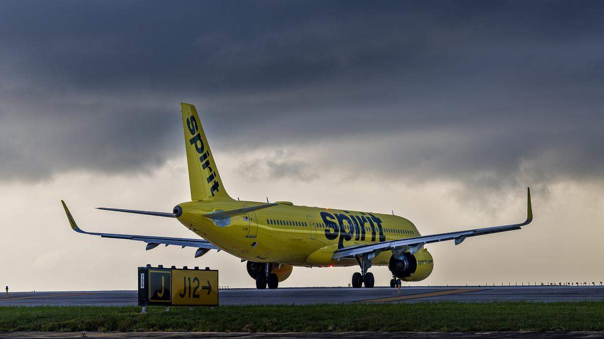 A Spirt Airlines plane gets ready to take off into a cloudy sky from Fort Lauderdale-Hollywood International Airport on Tuesday, Aug. 19, 2025.


