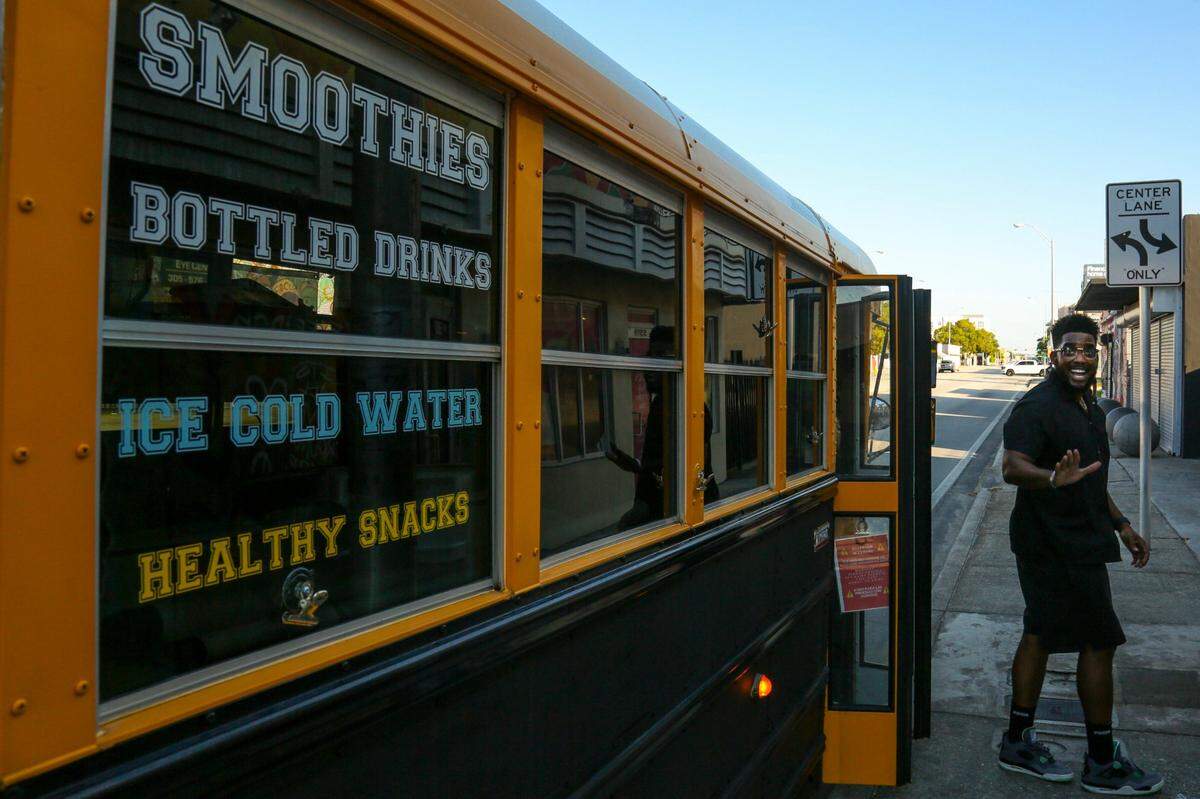 George Caesar, a Liberty City math teacher and founder of Smoothies 4 Students, delivers smoothies at Village Free(dge), 5507 NW Seventh Ave. in Miami, on Saturday, Oct. 16, 2021.