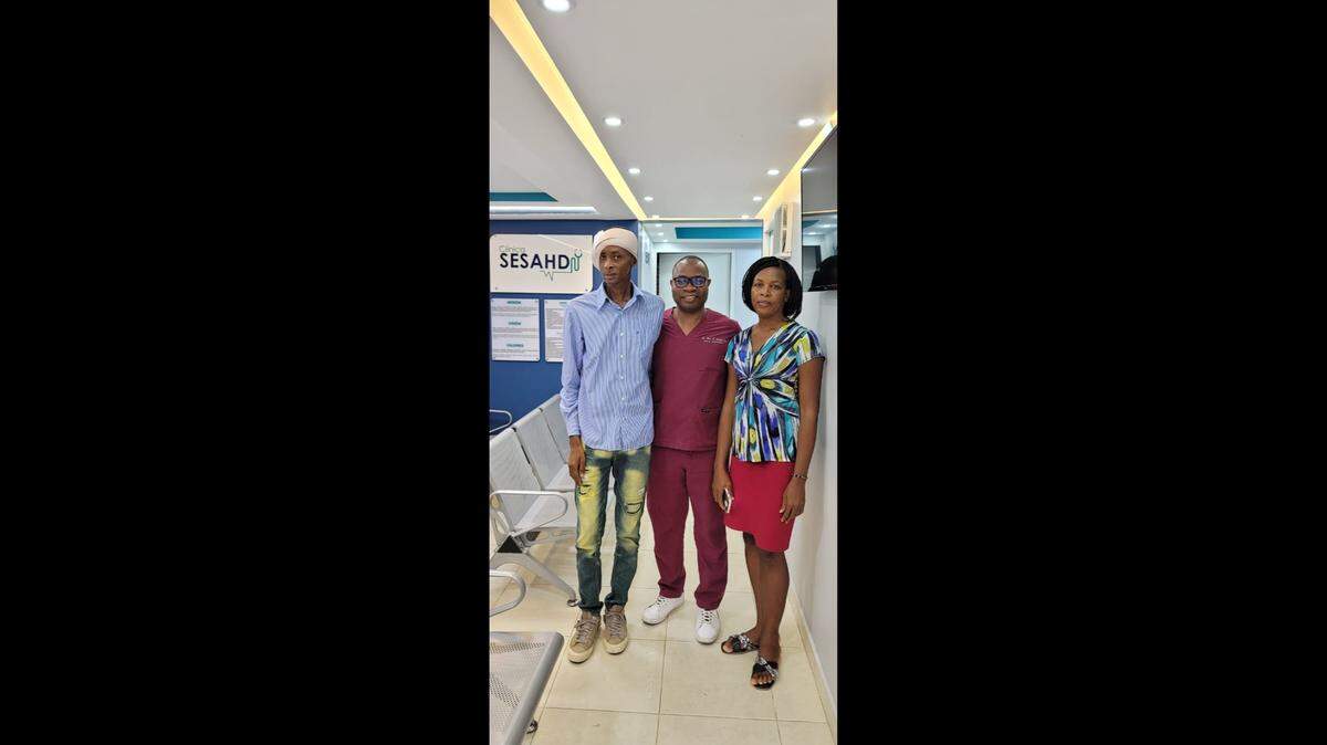 Jean Fritz Dieu, left, and his wife Ivonne Charles with Dr. Oriol Jn Baptiste, founder of SESAHD Services de Santé Haitiano-Dominicaine.
