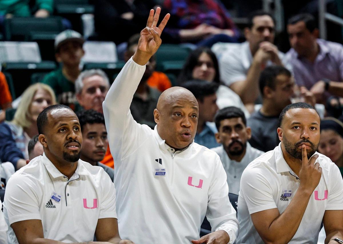 Miami Hurricanes assistant coach DJ Irving, interim head coach Bill Courtney, and assistant coach Kotie Kimble react in the second half of their ACC basketball game against the Virginia Cavaliers at the Watsco Center in Coral Gables, Florida on Wednesday, January 29, 2025.
