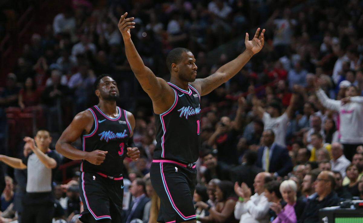 Miami Heat guard Dion Waiters (11) and Dwyane Wade (3) walk to the bench in the fourth quarter of an NBA basketball game against the Denver Nuggets at AmericanAirlines Arena on Tuesday, January 8, 2019 in Miami.