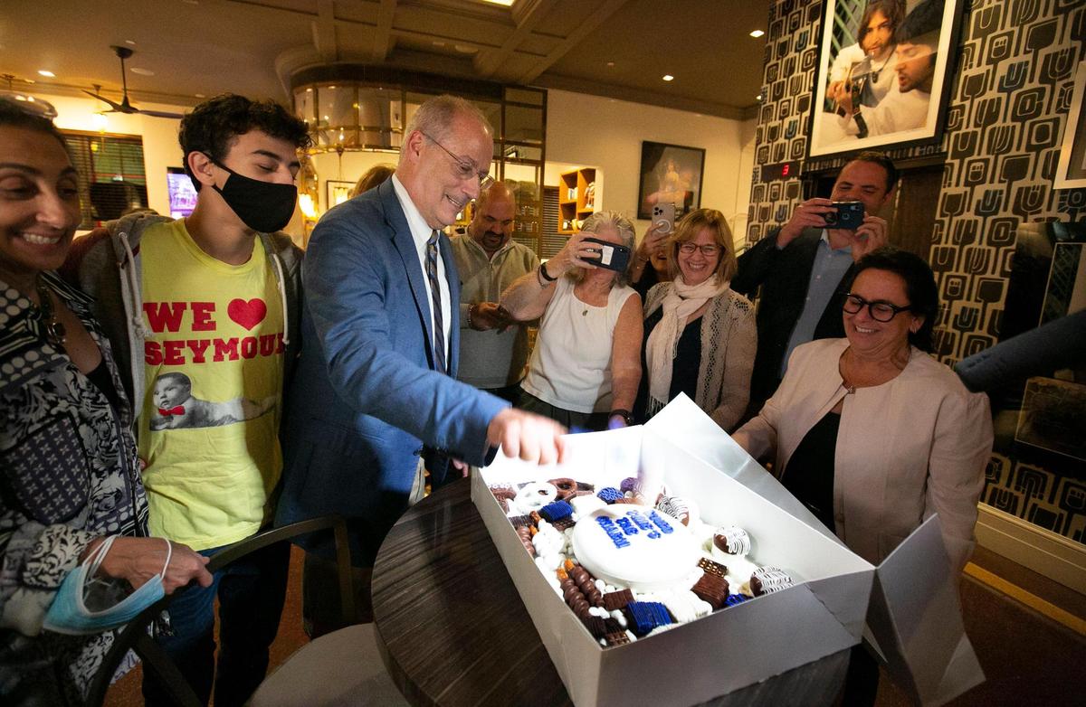 Miami Beach Mayor Dan Gelber smashes a hammer on a cake that reads “Third Time’s the Charm!” and was filled with his favorite Swedish Fish Candy at his re-election party at The Carlyle hotel, Miami Beach, Tuesday, November 2, 2021.