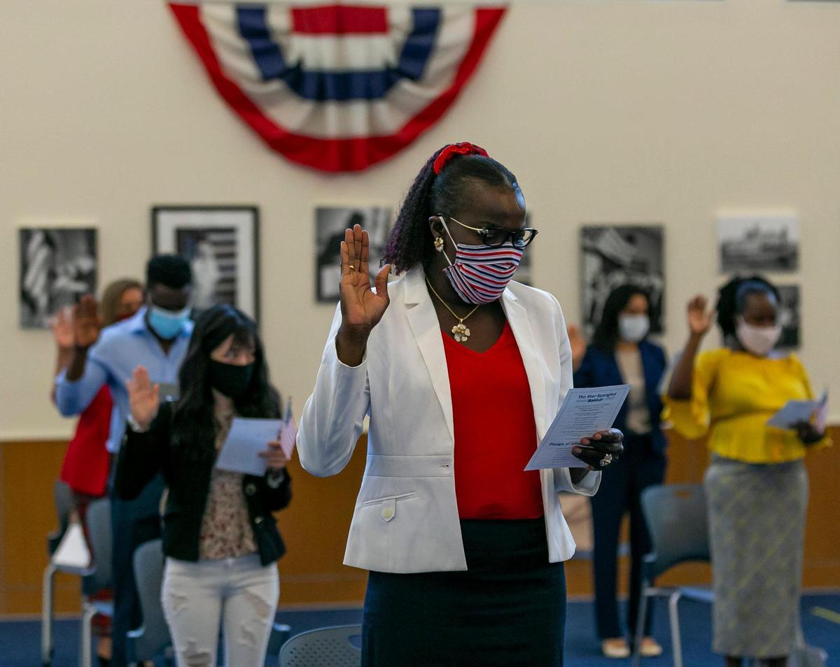 Fatoumata Zinsou participates in a naturalization ceremony for people becoming American citizens at the U.S. Citizenship & Immigration Services District Office in Miami, Florida on Friday, October 2, 2020.