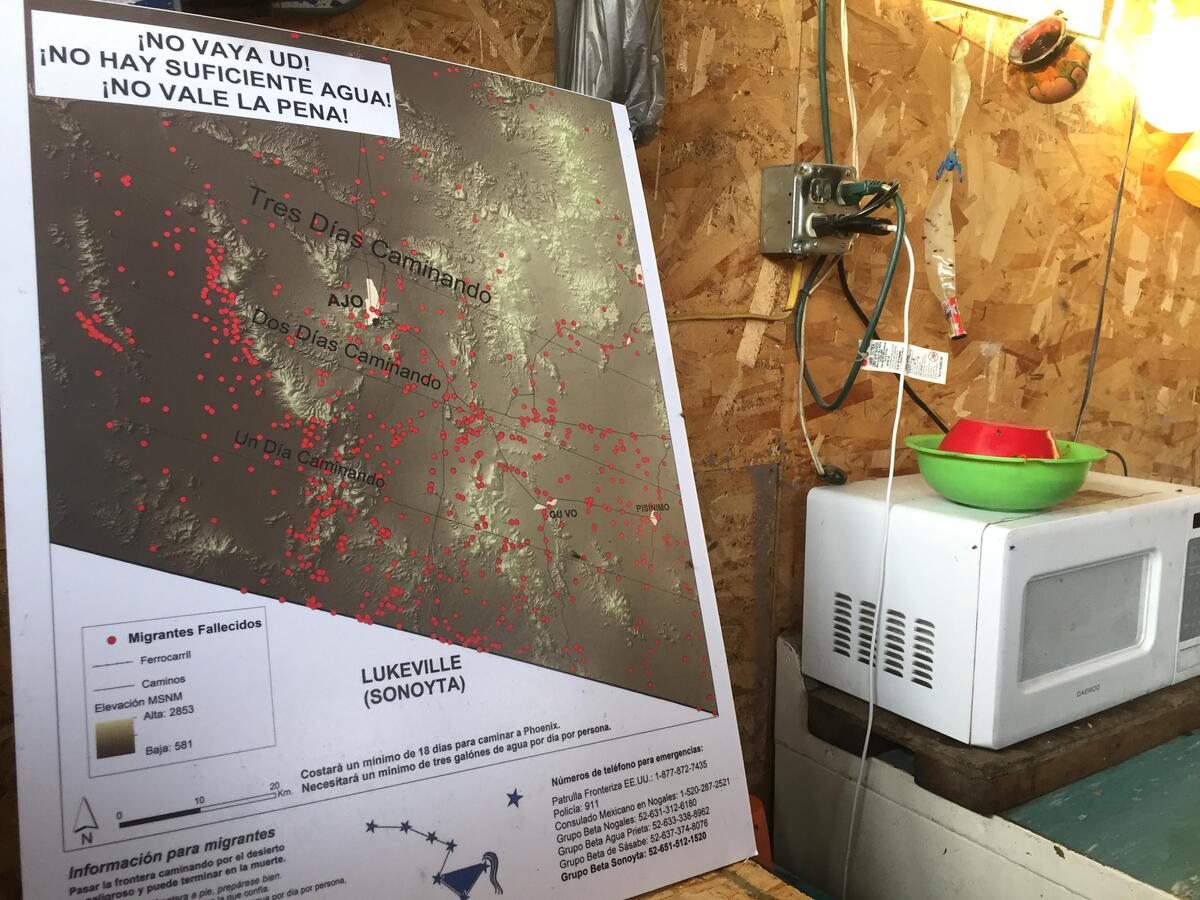 Arturo Roy Antonio, an immigrant from Puerto Cabeza, Nicaragua, shows a map reviewed by those who stay at a makeshift immigrant camp in the Mexican city of Sonoyta, across from remote Lukeville, Arizona. The map depicts deaths in the sweltering hot and arid region that includes the Organ Pipe Cactus National Monument, An Afro-Nicaraguan, he asked that his face not be shown and said he did not plan to enter the United States but hoped to return home despite economic misery in his coastal town.