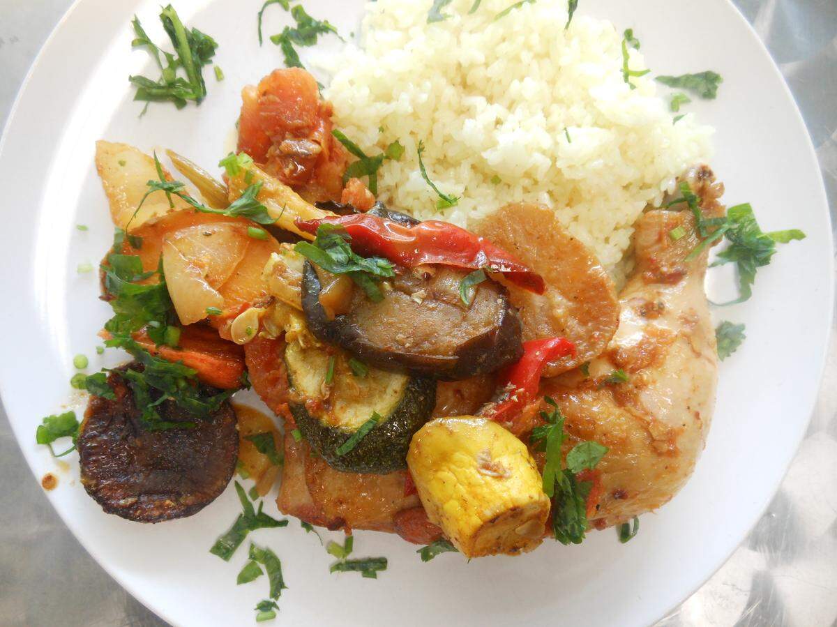  Roasted chicken leg and thigh with vegetables and rice at Shirin Glatt. 