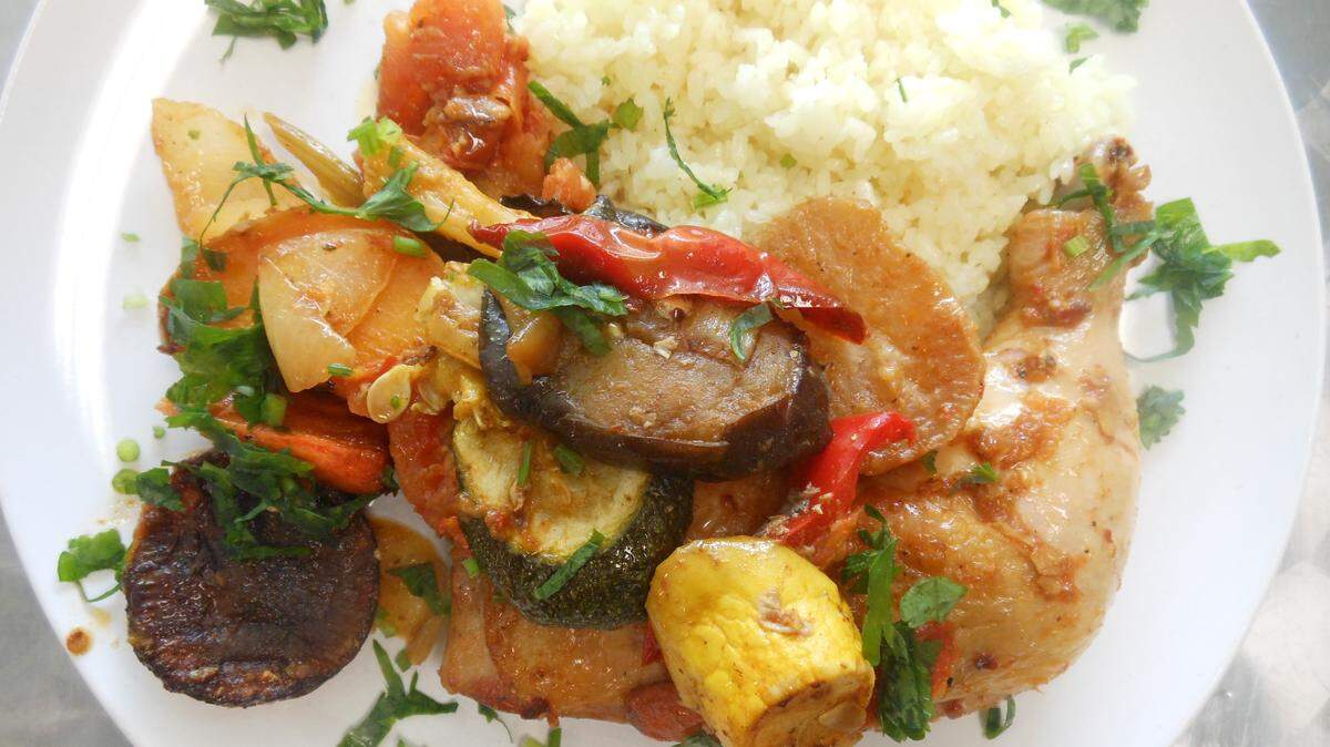  Roasted chicken leg and thigh with vegetables and rice at Shirin Glatt. 