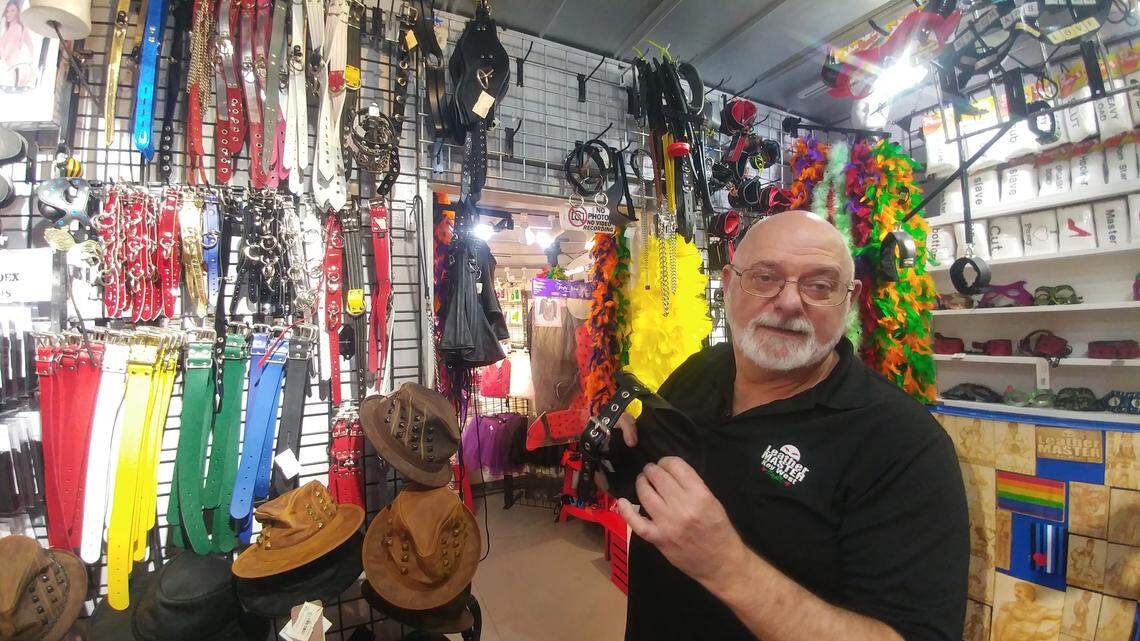 David Sieminski, the co-owner of Leather Master of Key West, a costume and fetish shop, shows off the merchandise on Oct. 21, 2019.