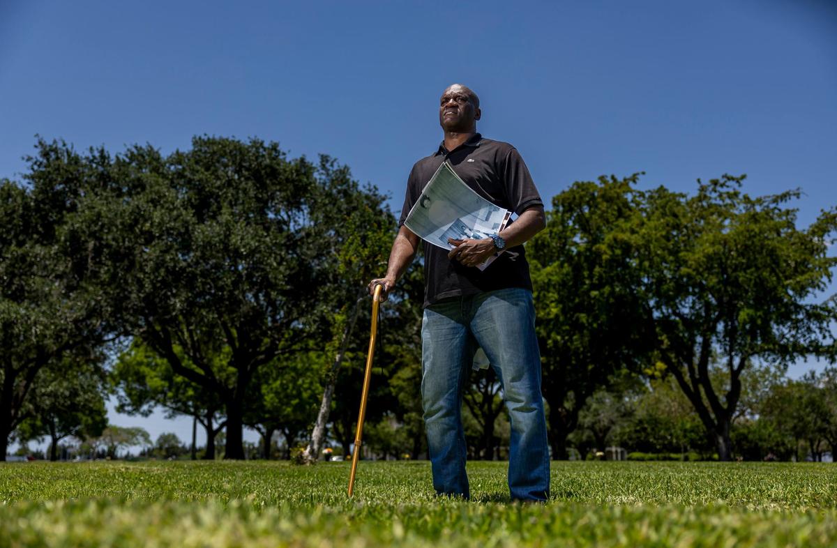Augustin Lorfils, 53, visits Our Lady of Mercy Catholic Cemetery on Friday, May 10, 2024, in Doral, Fla. Lorfils’ mother and five siblings, who died a tragic death at sea after being thrown overboard, are buried at the cemetery and he is now working to place headstones at their grave site.