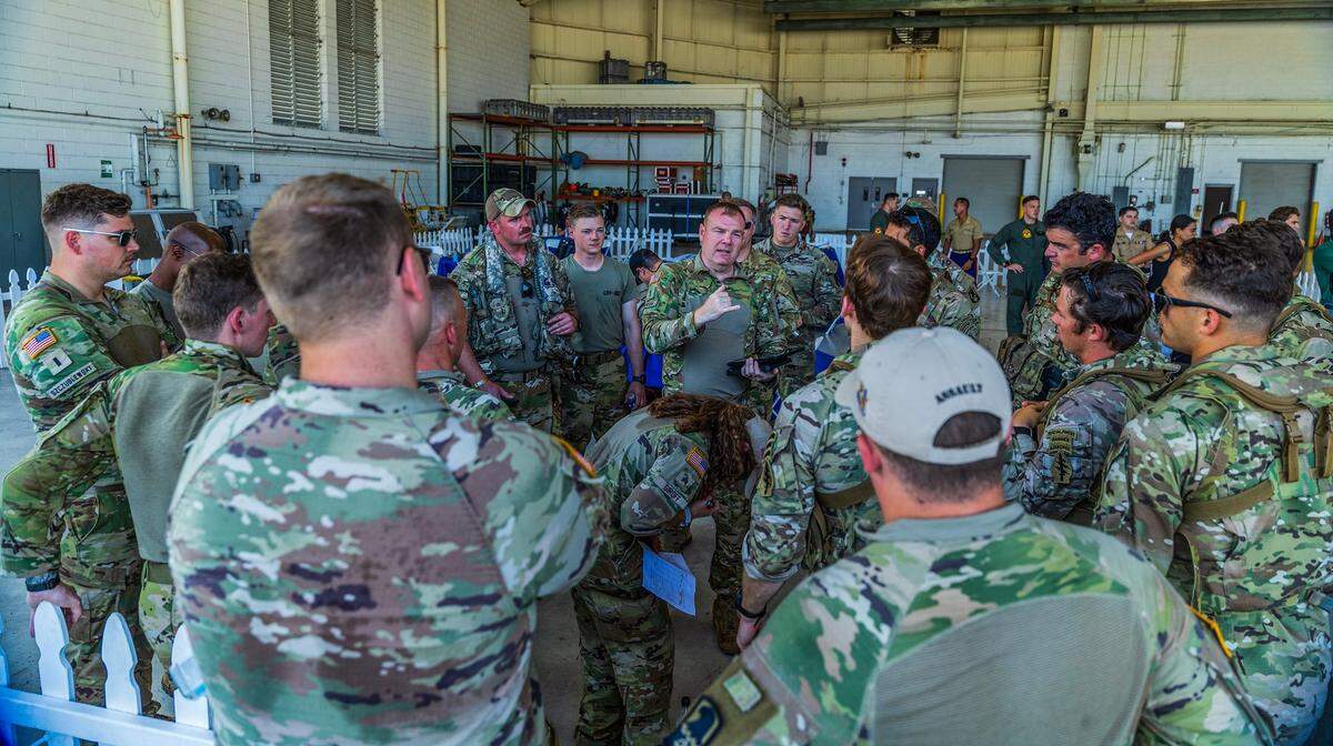 Military crews and pilots prepare to depart from the U.S. Coast Guard Air Station in Opa-locka for a practice flight over South Beach, ahead of the Hyundai Air & Sea Show’s return to Miami Beach for the annual National Salute to America’s Heroes on Friday, May 23, 2025.