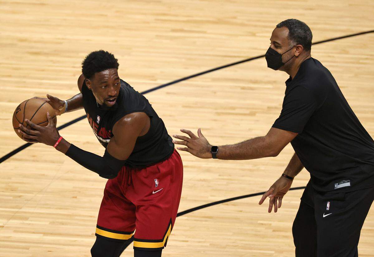 Miami Heat center Bam Adebayo (13) works with Heat assistant coach Malik Allen before the start of Game 3 of their first-round playoff series against the Milwaukee Bucks on Thursday, May 27, 2021 at AmericanAirlines Arena in Miami, Florida.