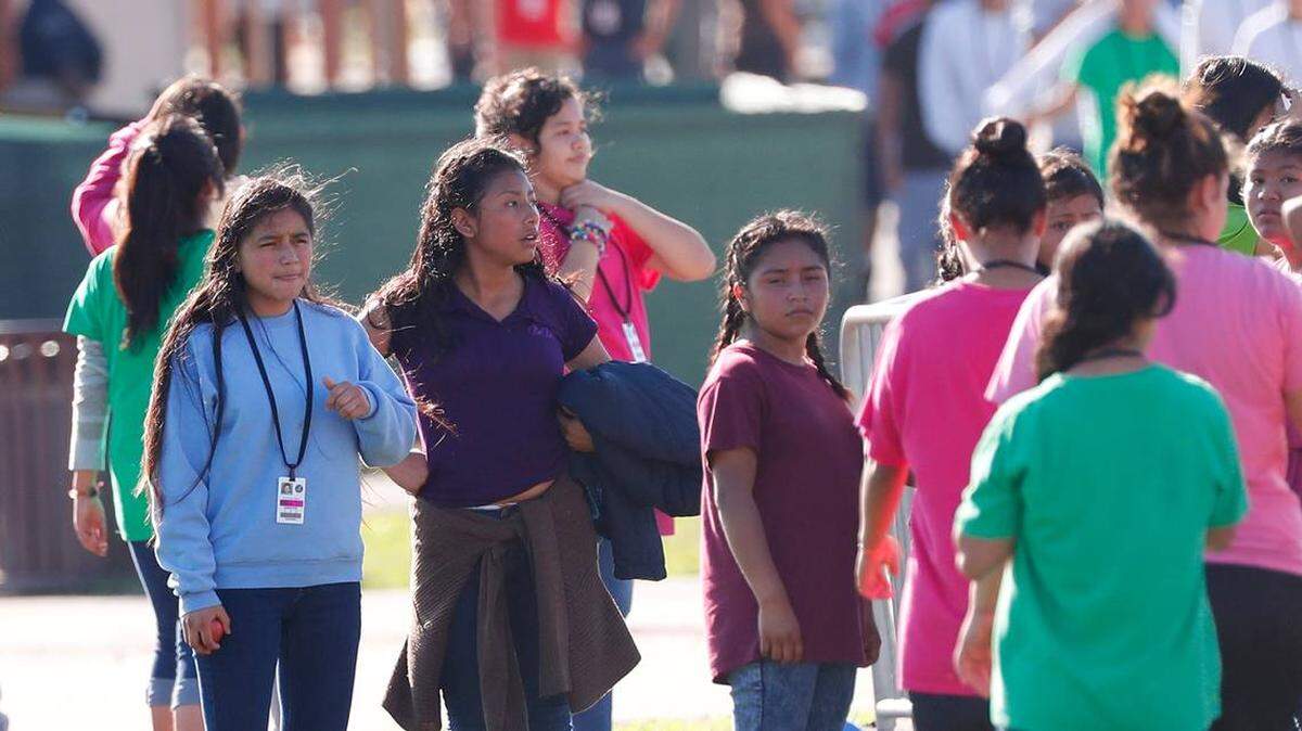 In February, girls rest after playing soccer at the Homestead Temporary Shelter for Unaccompanied Children.