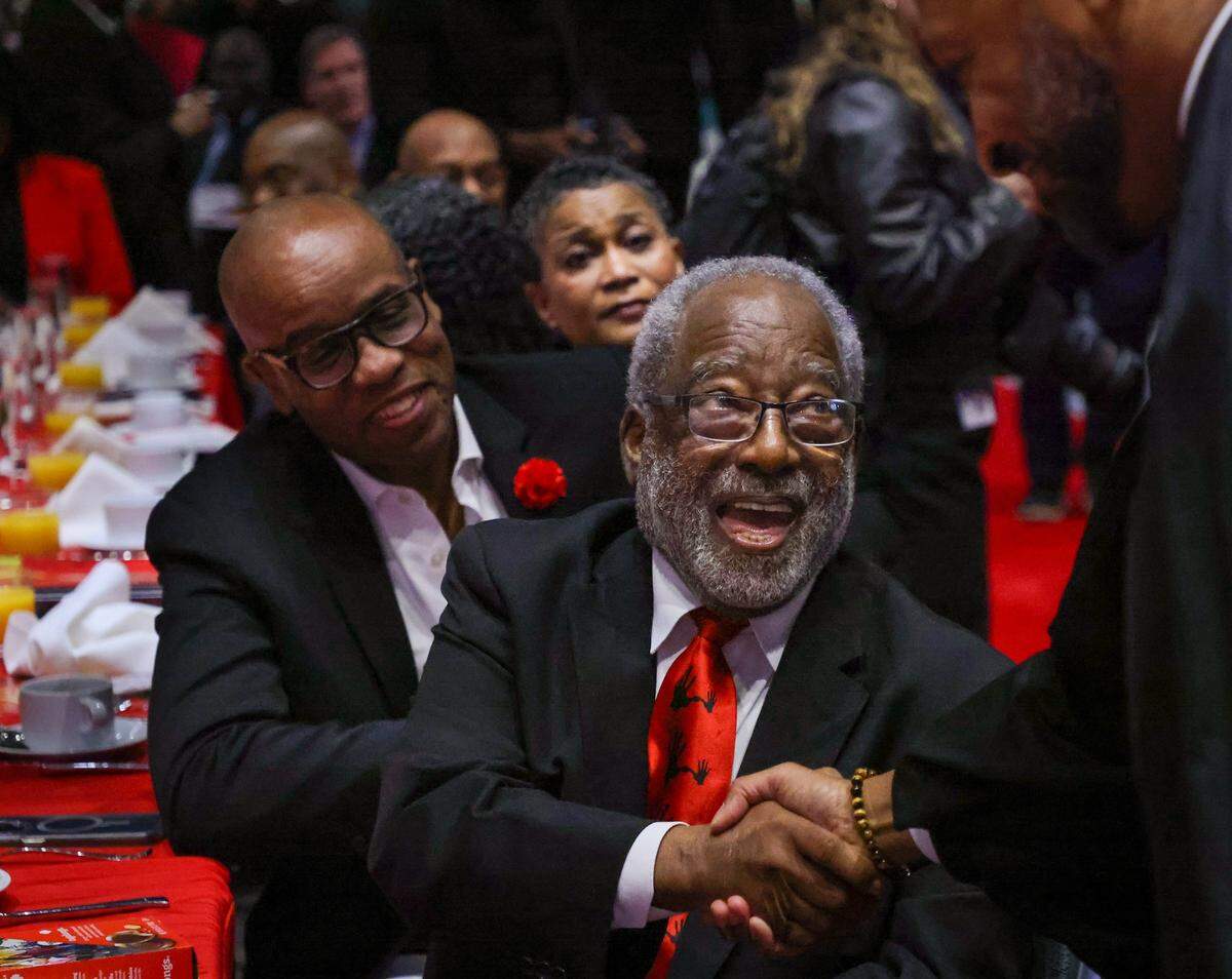 H.T. Smith, center, a prominent attorney and 5000 Role Models mentor, shakes hands with U.S. District Judge Darrin Gayles as 2026 inductee Marlon Hill, Esq., looks on.The 5000 Role Models held its 33rd Annual Dr. Martin Luther King, Jr. Annual Scholarship Breakfast with Keynote Speaker Bishop Neil C. Ellis, and the 2026 Headliners consisting of Lee “Freezy Prince” Prince, Tramar “Flo Rida” Lacel Dillard, Maurice “Trick Daddy” Samuel Young, and Khaled “ DJ Khaled” Mohammed Khaled, on Monday, January 19, 2026, at the Miami Beach Convention Center, in Miami Beach, Florida. 