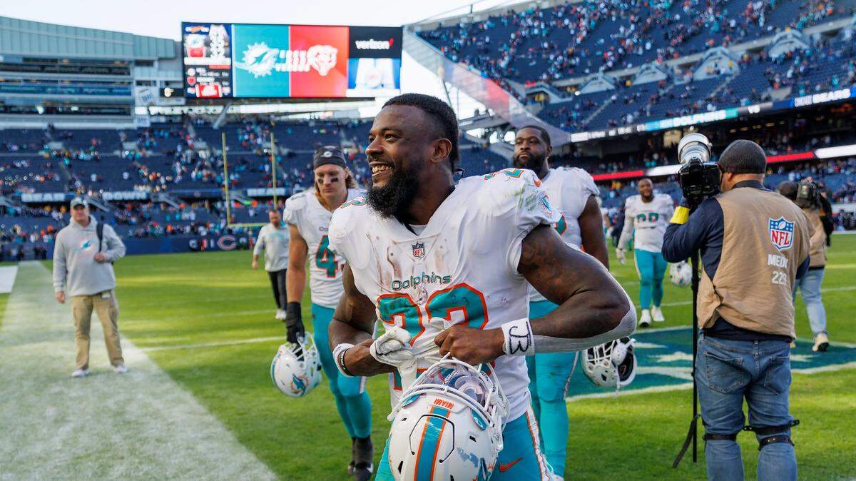 Miami Dolphins running back Jeff Wilson Jr. (23) walks off the field after their 35-32 win over the Chicago Bears during first quarter of an NFL football game at Soldier Field on Sunday, November 6, 2022 in Chicago, Illinois.